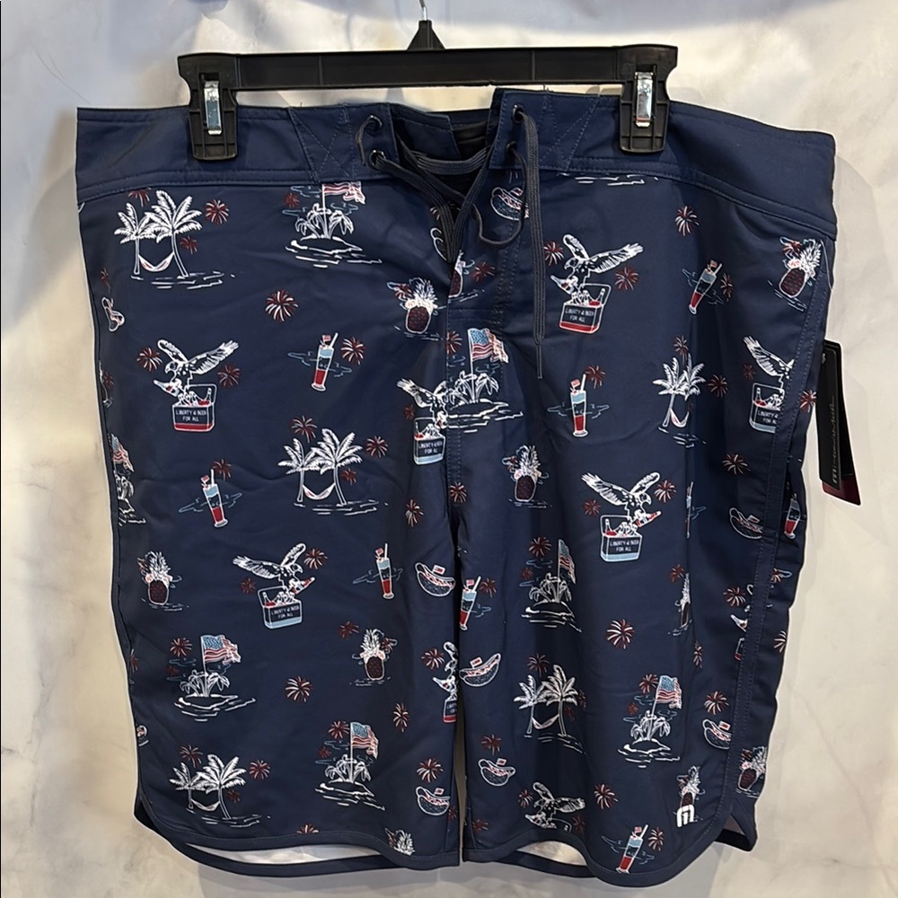 Travis Mathew Navy Blue Swim Shorts with Tropical Print